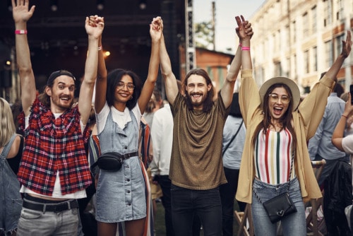 friends with joined hands raised in the air, core values to guide recovery