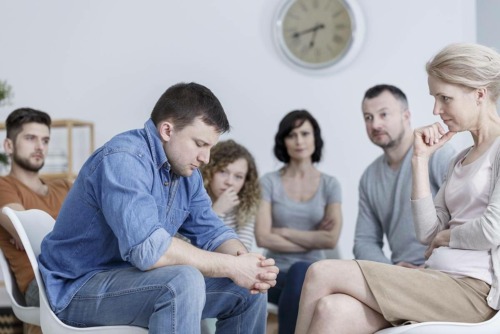 man in therapy circle knows what is rehab like