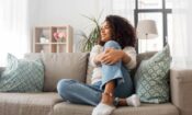 woman sitting on a couch thinking about detoxing at home