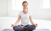 woman in meditative pose wondering does yoga help with chronic pain