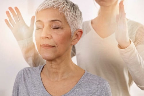 an older woman undergoing holistic pain management