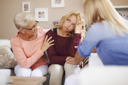 daughter mother and grandmother talking about addiction, how to talk to family about addiction