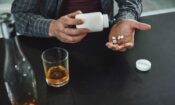 man taking pills may be wondering is drug addiction a choice