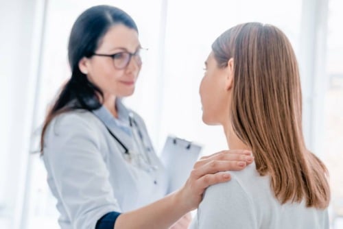 a woman talking to her doctor about medical drug detox