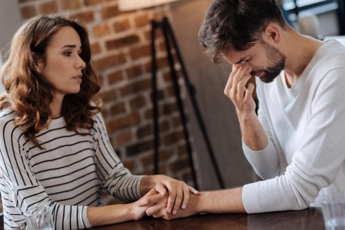 a couple discussing treatment options for a mental illness and substance abuse program