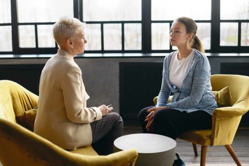 a doctor discussing mindfulness based stress reduction with a patient