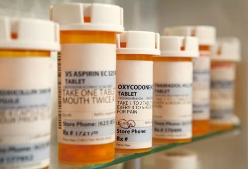 most-abused-prescription-drugs a picture of pill containers showing the most abused prescription drugs
