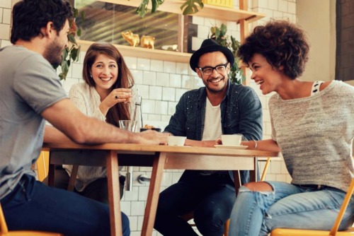 a group of friends meeting at a coffee during national recovery month