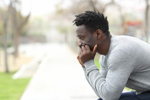 a man thinking about his friend finding replacement addictions