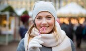 a woman eating a candy cane learning how to stay sober over the christmas holiday