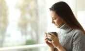 a woman praciticing stress management techniques while at work