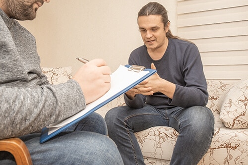 man participates in talk therapy program