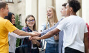 a group bringing their hands together at a teen rehab center in kemah