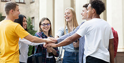 a group bringing their hands together at a teen rehab center in kemah