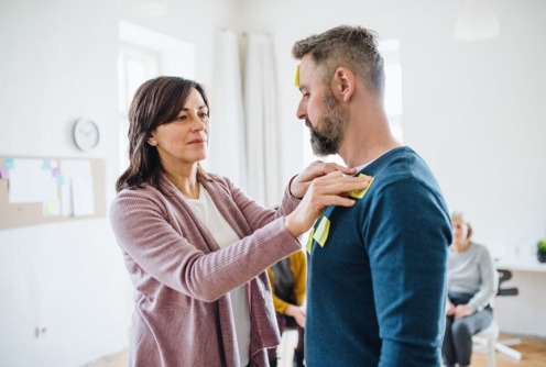 a male and female use sticky notes and explore the different types of psychotherapy