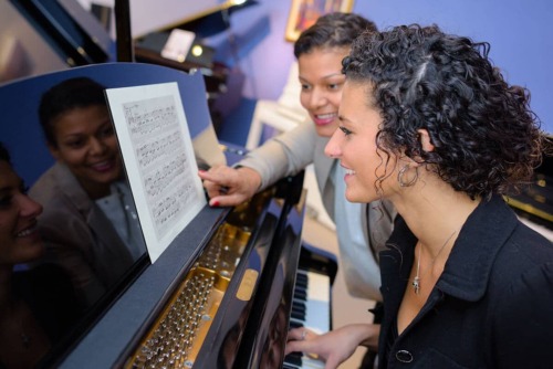 two women learning what is music therapy like