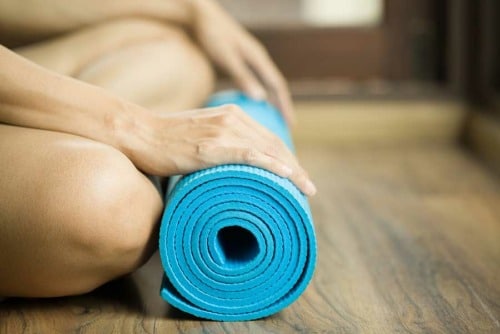 Rolled up yoga mat after yoga therapy at drug rehab