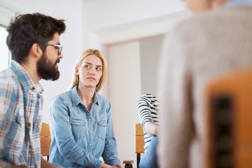 Patient sitting a group in a Galveston drug rehab