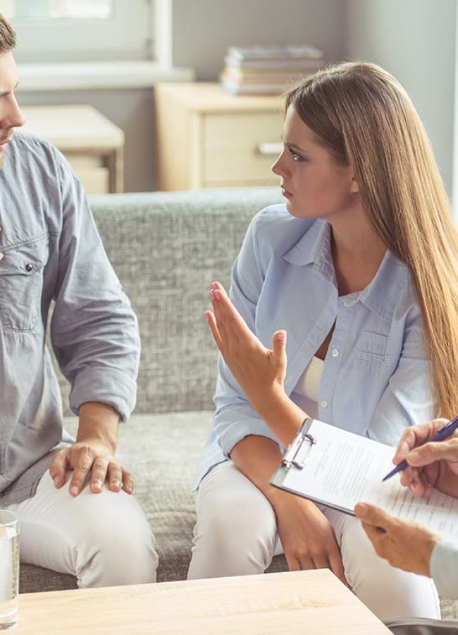 man and woman speaking with therapist during his stay at a mens alcohol rehab center in south houston