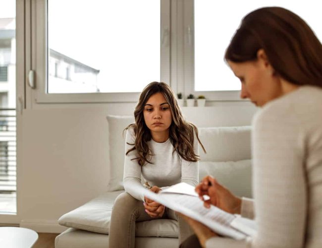 Young adult speaking with therapist about meth addict addiction