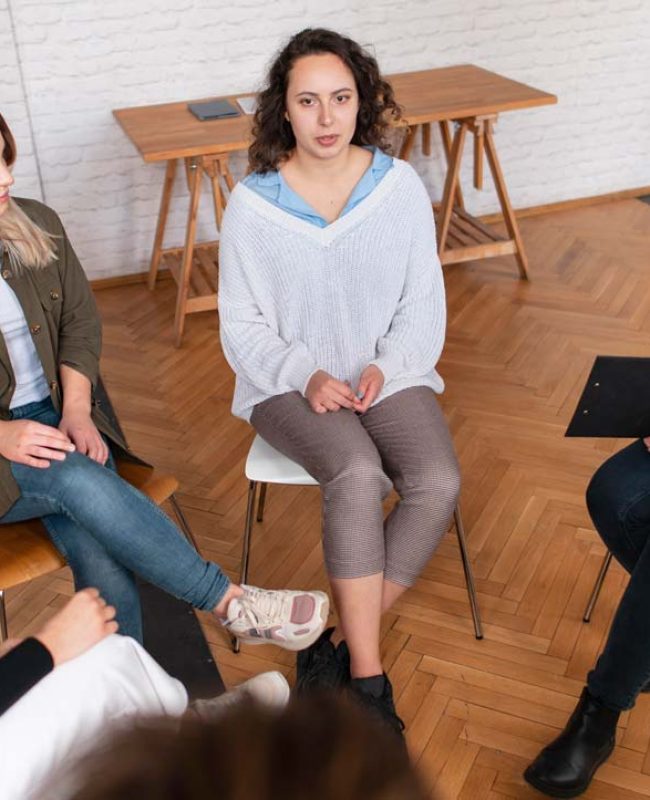 women sitting in group therapy at a women's alcohol rehab center in south houston