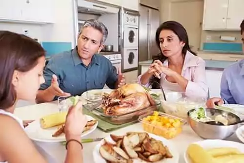 Parents speaking with their child on how to avoid relapse during Thanksgiving