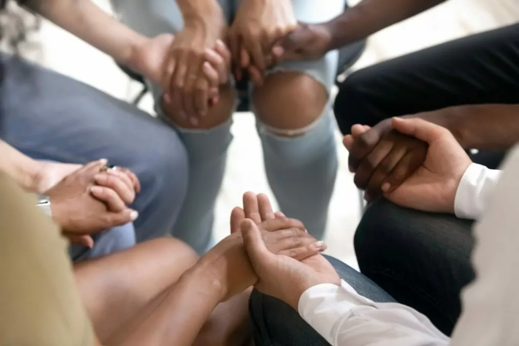 group of men and women sitting in a circle during intensive outpatient program in south houston