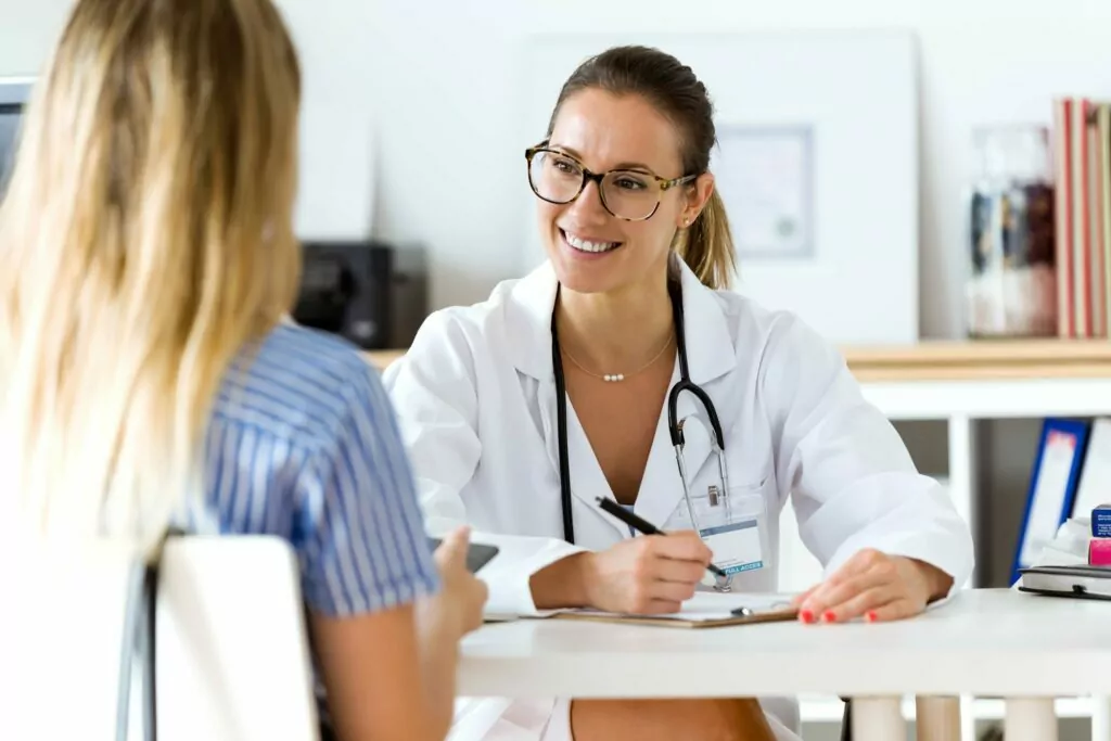 A doctor and woman discussing Prescription Drug Detox in Houston.